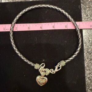 Silver and Gold Tone Heart charm on leather necklace.
